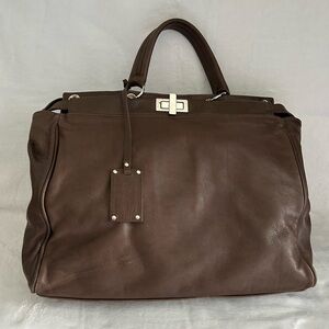 Brown leather large “peekaboo” handbag with silver hardware.